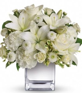 Our cube design is overflowing in the seasons most beautiful white flowers. 