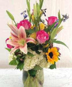 Send this joyful summertime bouquet of Roses and Sunflowers to your loved ones today! 