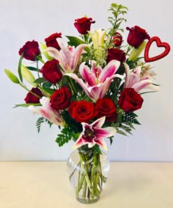 Stargazer lilies and red roses put love in the air!