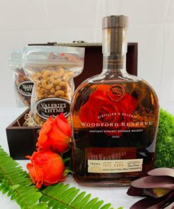 A bottle of Woodford Reserve Bourbon is the perfect choice no matter what the celebratory occasion may be. When sending this bottle, you are also sending Grapevine, Texas’ own Valerie’s Thyme large cashews and small almonds to compliment. Our hand tied jewel toned blooms are the final touch.