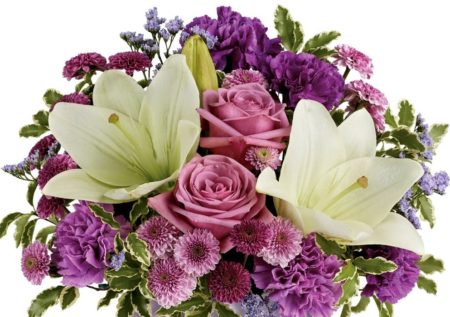 Lavender roses, white asiatic lilies, purple carnations, lavender carnations, purple button spray chrysanthemums and lavender button spray chrysanthemums are arranged with lavender limonium and pitta negra.