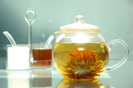 Flowering tea in a clear glass tea pot