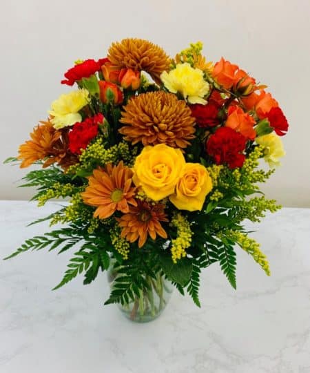 Our small vase of beautiful fall colors is perfect for the season.  Will look lovely on a kitchen table or side table.