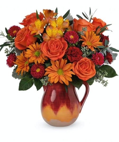 Two gorgeous autumnal gifts in one, this fabulous fall bouquet is arranged in an ombre stoneware pitcher that's hand-glazed and food-safe for years of entertaining delight.  