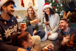 Group of friends laughing on Christmas Party